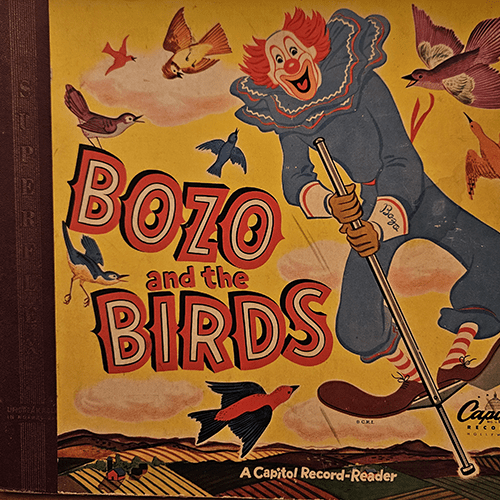 The cover of Bozo and the Birds: A Capitol Record-Reader features Bozo the Clown joyfully interacting with colorful birds, set against a vibrant, illustrated background. A true vintage collectible.