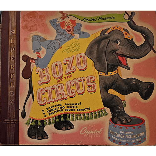 Cover of Bozo at the Circus by Capitol Records, featuring Bozo the Clown and an elephant on a vintage design. This collectible album includes vibrant illustrations, music, and engaging sound effects.