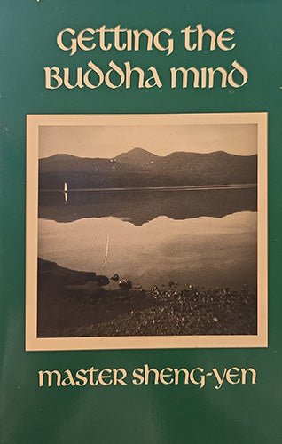 Book cover of 'Getting the Buddha Mind' by Master Sheng-Yen, featuring a green background with cream-colored text and a central sepia-toned photograph of a mountain lake reflection.