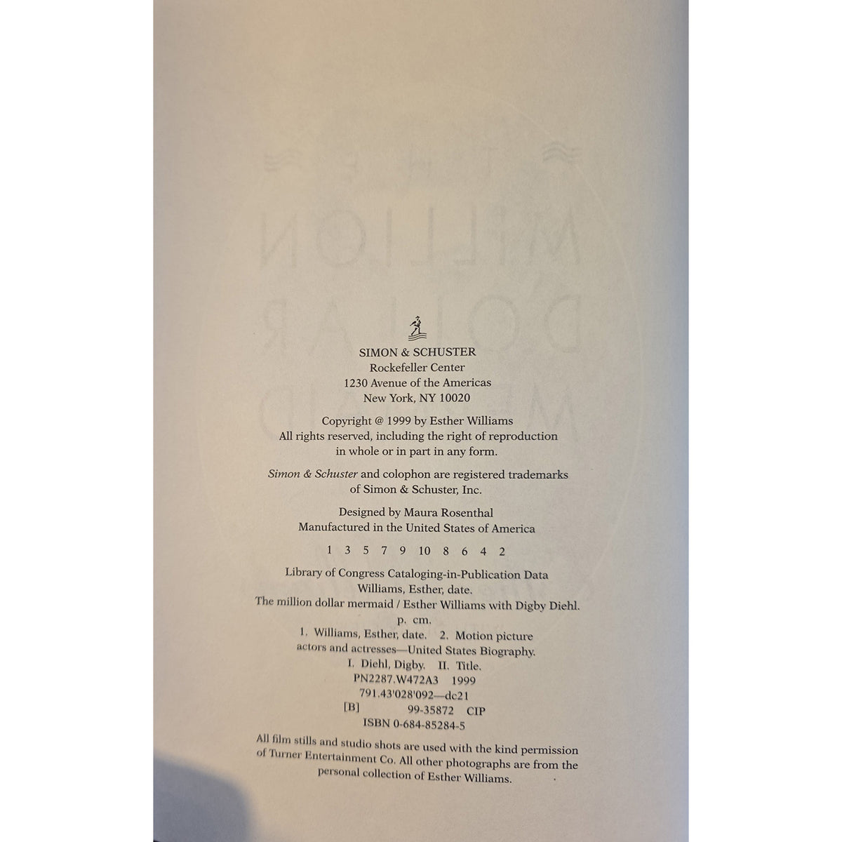The back cover of a Simon & Schuster book, featuring black copyright and publication details printed on a light gray background with a faintly visible illustration.