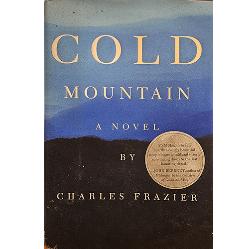 The cover of Cold Mountain features a serene blue and black mountain landscape under a vast sky. The title "COLD MOUNTAIN" is in bold white letters, with the author’s name, Charles Frazier, below.