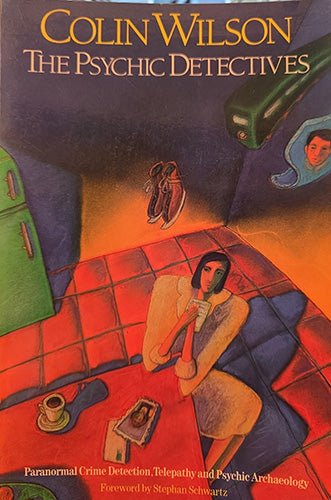 Book cover for 'Colin Wilson: The Psychic Detectives' featuring a stylized illustration of a seated woman in a room with red tiled floors, green cabinets, and dark blue walls.