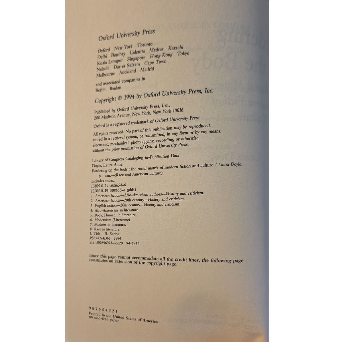 A close-up of a printed book or publication page showing copyright and publisher text for Oxford University Press, photographed against a light neutral background.