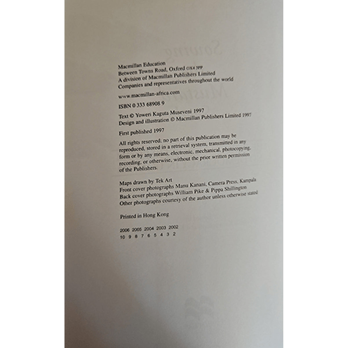 A close-up of a book's copyright page showing publication details and publisher information for Macmillan Education and Macmillan Publishers Limited.