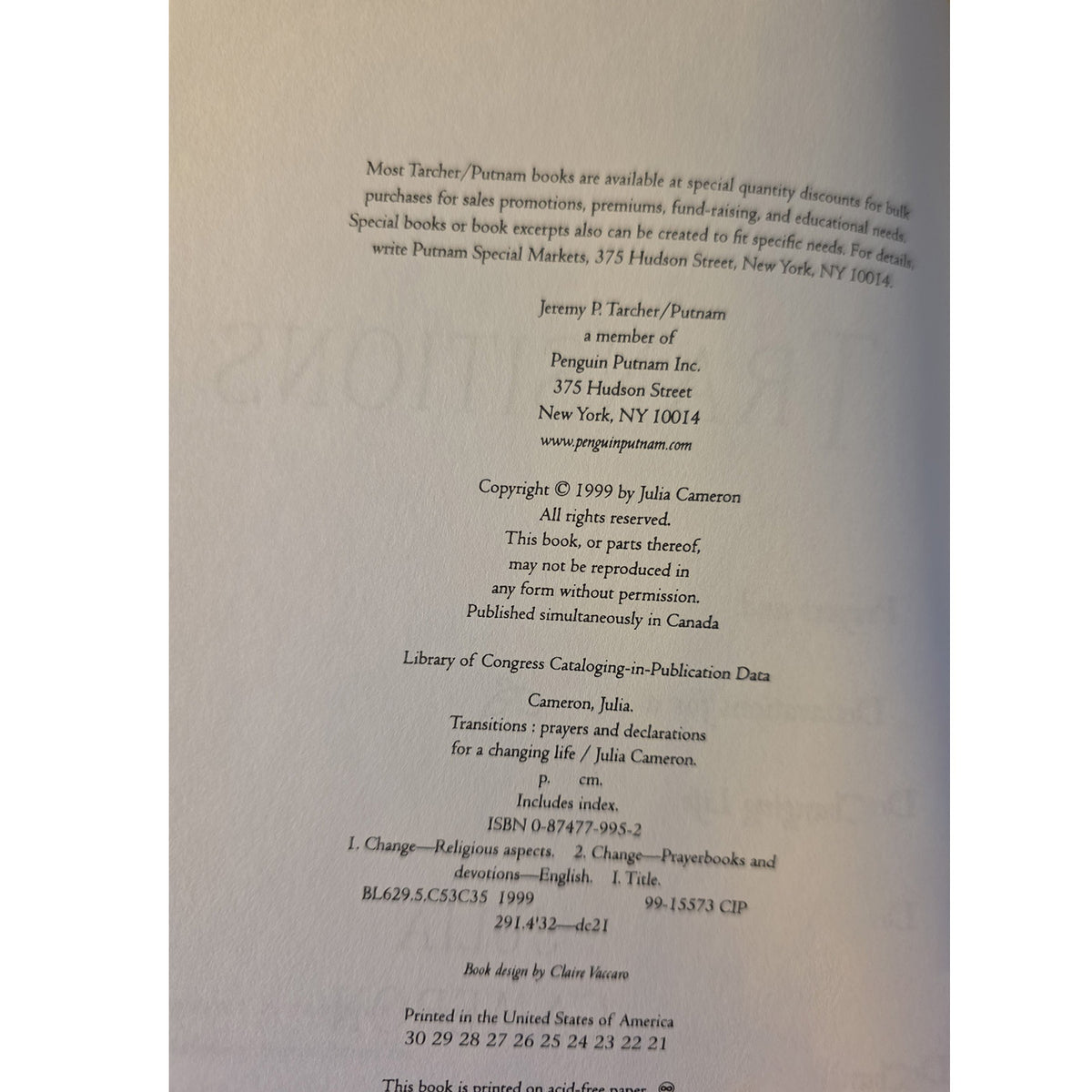 A photographed book cover or printed page with black text on an off-white background, photographed at a slight angle. Visible text includes publisher information for Penguin Putnam and publication details.
