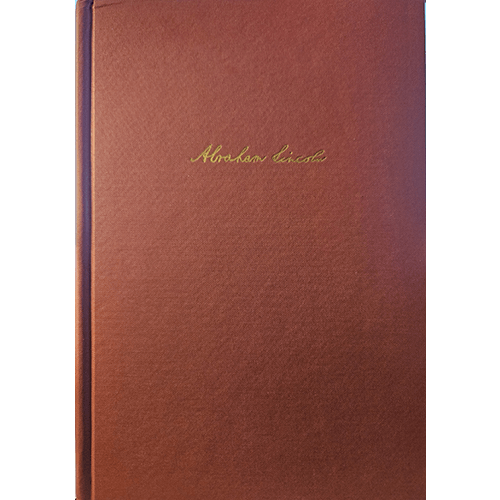 Red cloth book with 'Abraham Lincoln' embossed on the cover 