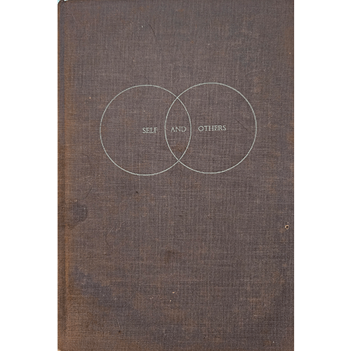 The cover of Self and Others by R.D. Laing features two interlocking circles symbolizing human connection, set against a textured brown fabric background, highlighting its intellectual focus.