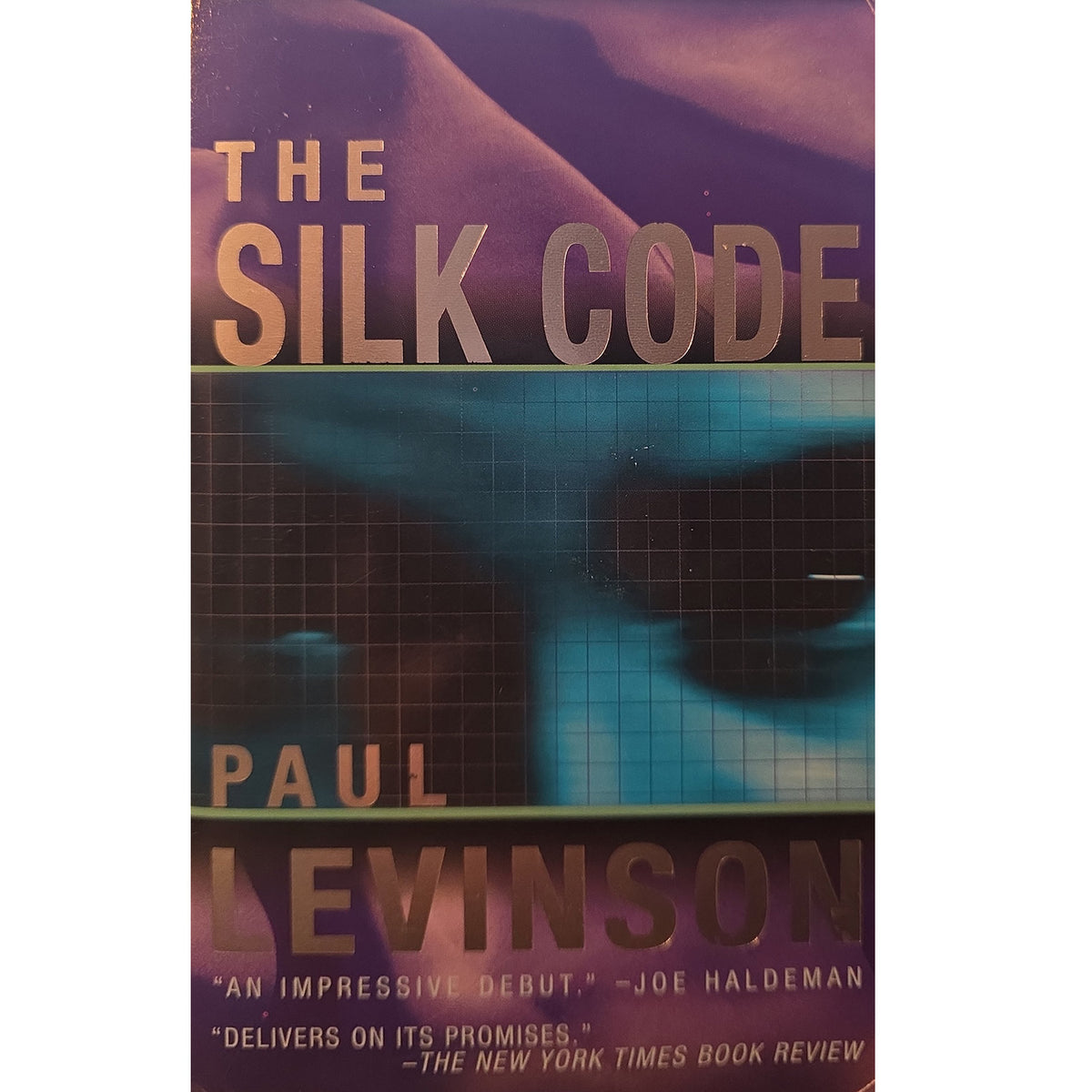 The front cover of the book 'The Silk Code' by Paul Levinson, featuring a purple and blue-toned abstract design with the title and author name in large tan lettering.