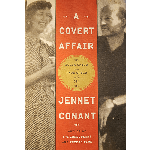 The cover of A Covert Affair features Julia and Paul Child with sepia-toned images, highlighting their involvement in the OSS during WWII. The design includes a bold red banner with the book's title and author.