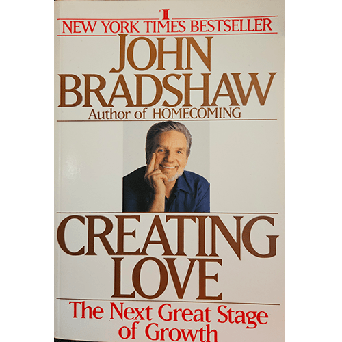 The cover of Creating Love by John Bradshaw features the author smiling, set against a white background, with bold brown title text and a red subtitle that reads "The Next Great Stage of Growth."