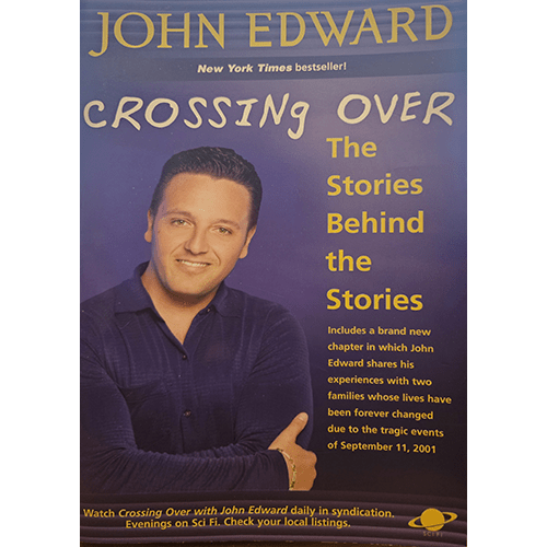 Cover of "Crossing Over: The Stories Behind the Stories" by John Edward features the author smiling with arms crossed, set against a purple background with yellow text highlighting the book's themes.