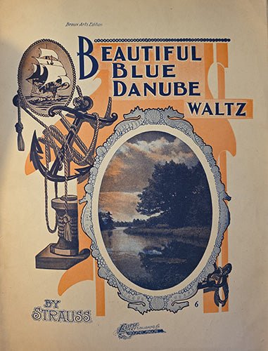 Sheet music cover for 'Beautiful Blue Danube Waltz' with decorative elements and an image of a lake.