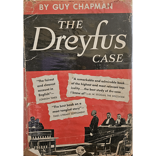 Cover of The Dreyfus Case by Guy Chapman features bold typography on a red and black background with courtroom artwork. It has visible wear, tears, and is protected by Brodart archival covering.