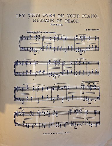 back cover shows Sheet music with text 'Try this over on your piano. Message of Peace' and musical notation.