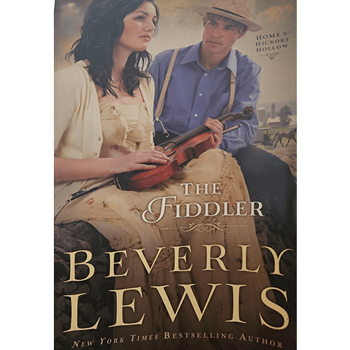 The cover of The Fiddler by Beverly Lewis features a woman in a floral dress holding a violin, while an Amish man in blue sits beside her in a rustic countryside setting.