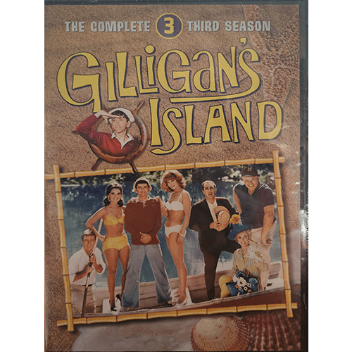 Cover of Gilligan's Island: The Complete Third Season DVD, showing the seven main characters standing together on the island in colorful costumes, framed by bamboo with the show's title above.