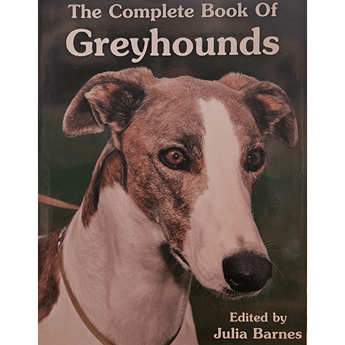 Cover of The Complete Book of Greyhounds edited by Julia Barnes, featuring a close-up image of a Greyhound with a brown and white coat. The title is displayed at the top in bold white letters.