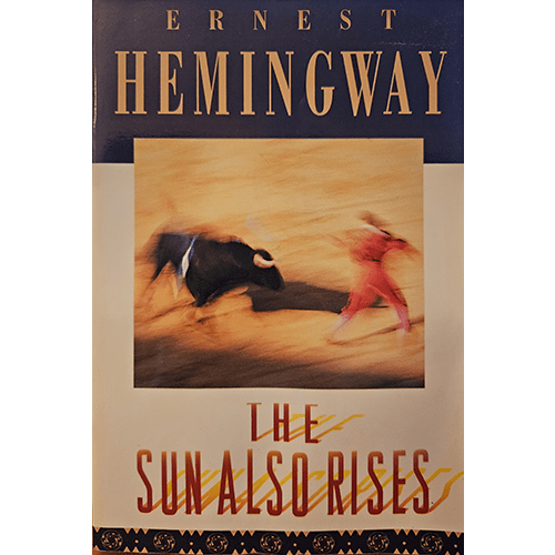 Cover of The Sun Also Rises by Ernest Hemingway, featuring a blurred image of a matador and bull in the ring, with a strong vintage design that emphasizes the novel's themes of struggle and tradition.