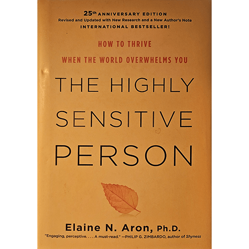 The cover of The Highly Sensitive Person by Elaine N. Aron, Ph.D., features a minimalistic design with a light brown background and a single leaf illustration, emphasizing the book’s focus on sensitive individuals.