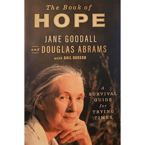 Cover of The Book of Hope by Jane Goodall and Douglas Abrams featuring Jane Goodall with a serene expression against a nature background. The subtitle reads, "A Survival Guide for Trying Times."