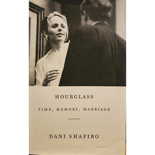 The book cover features a grayscale photograph of a woman gazing thoughtfully at a man, with a subdued title design reading Hourglass: Time, Memory, Marriage by Dani Shapiro. It conveys intimacy and reflection.