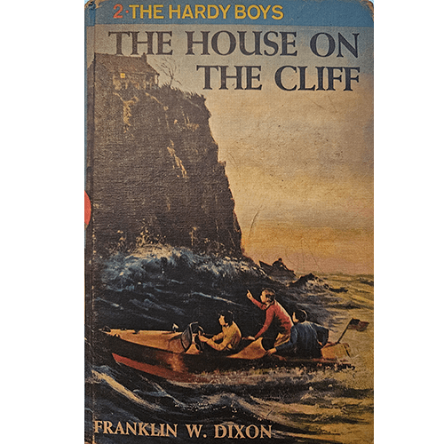 Cover of The House on the Cliff by Franklin W. Dixon. This 1959 Hardy Boys classic follows Frank and Joe Hardy as they investigate a suspicious cliffside mansion tied to a smuggling ring.