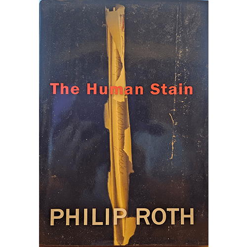 The cover of "The Human Stain" by Philip Roth features a dark background with a torn piece of parchment, revealing the title in bold red letters. The author's name, Philip Roth, is displayed prominently at the bottom in bold white letters.