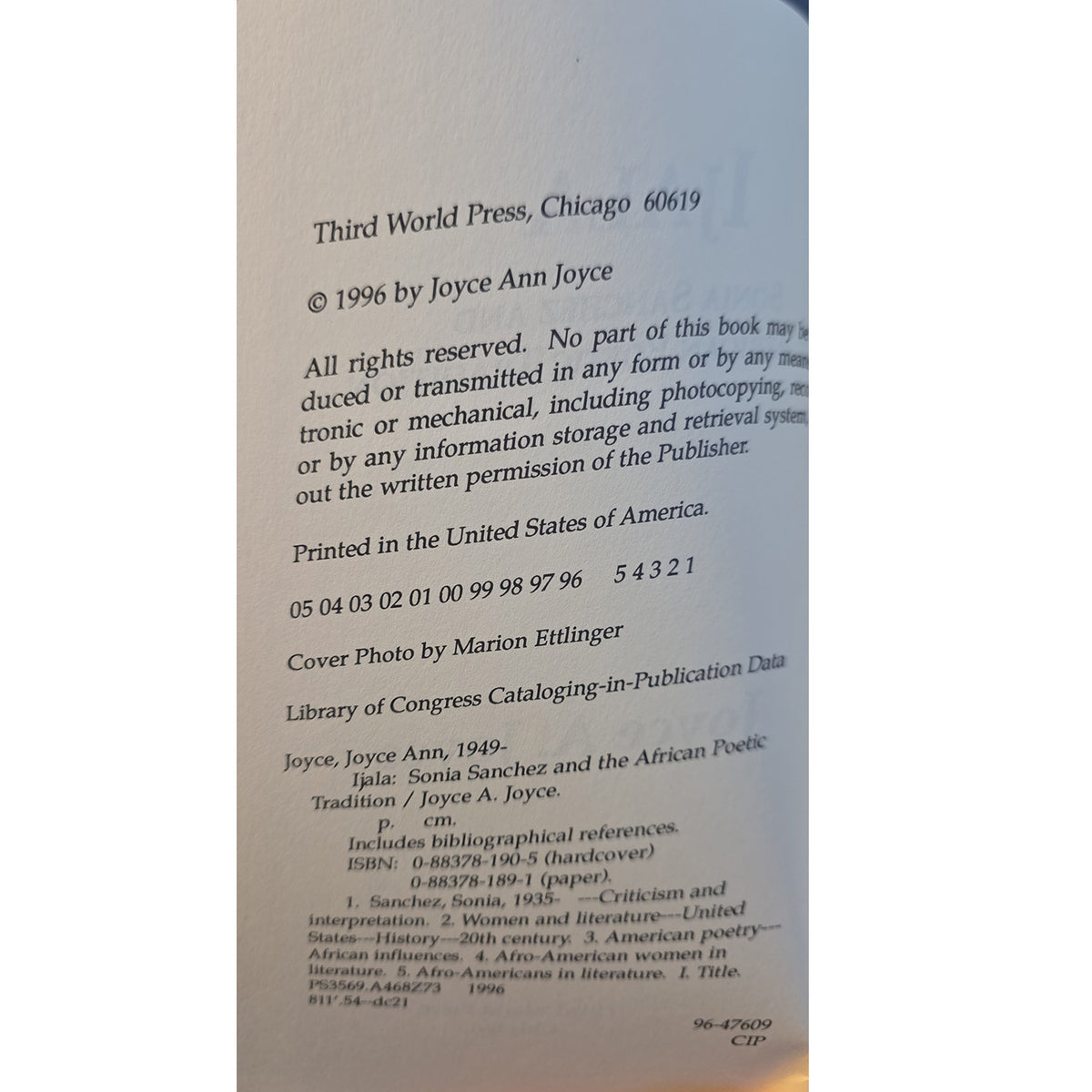 A close-up of a book's copyright page from Third World Press, showing publication details for 'Joyce Ann, 1949: Tradition / Joyce A. Joyce' published in 1996.