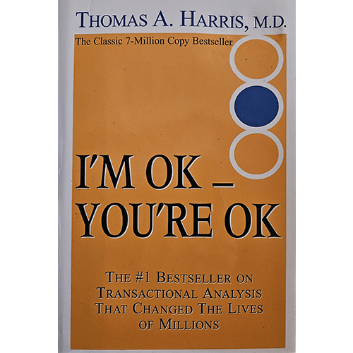 The cover of I'm OK - You're OK by Thomas A. Harris features a simple orange background with bold black text, circular graphics, and the subtitle highlighting its success as a transactional analysis bestseller.