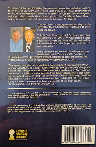 Back cover of a book titled 'The U-FO Cover-Up' by Grant Cameron and Scott Drain, showing a dark blue background with white text, two portrait photos of the authors, a Keyhole Publishing Company logo, and a barcode.