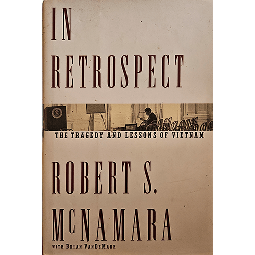 The cover of In Retrospect features bold typography with a sepia-toned image of McNamara in a conference room, reflecting on Vietnam’s tragic lessons.