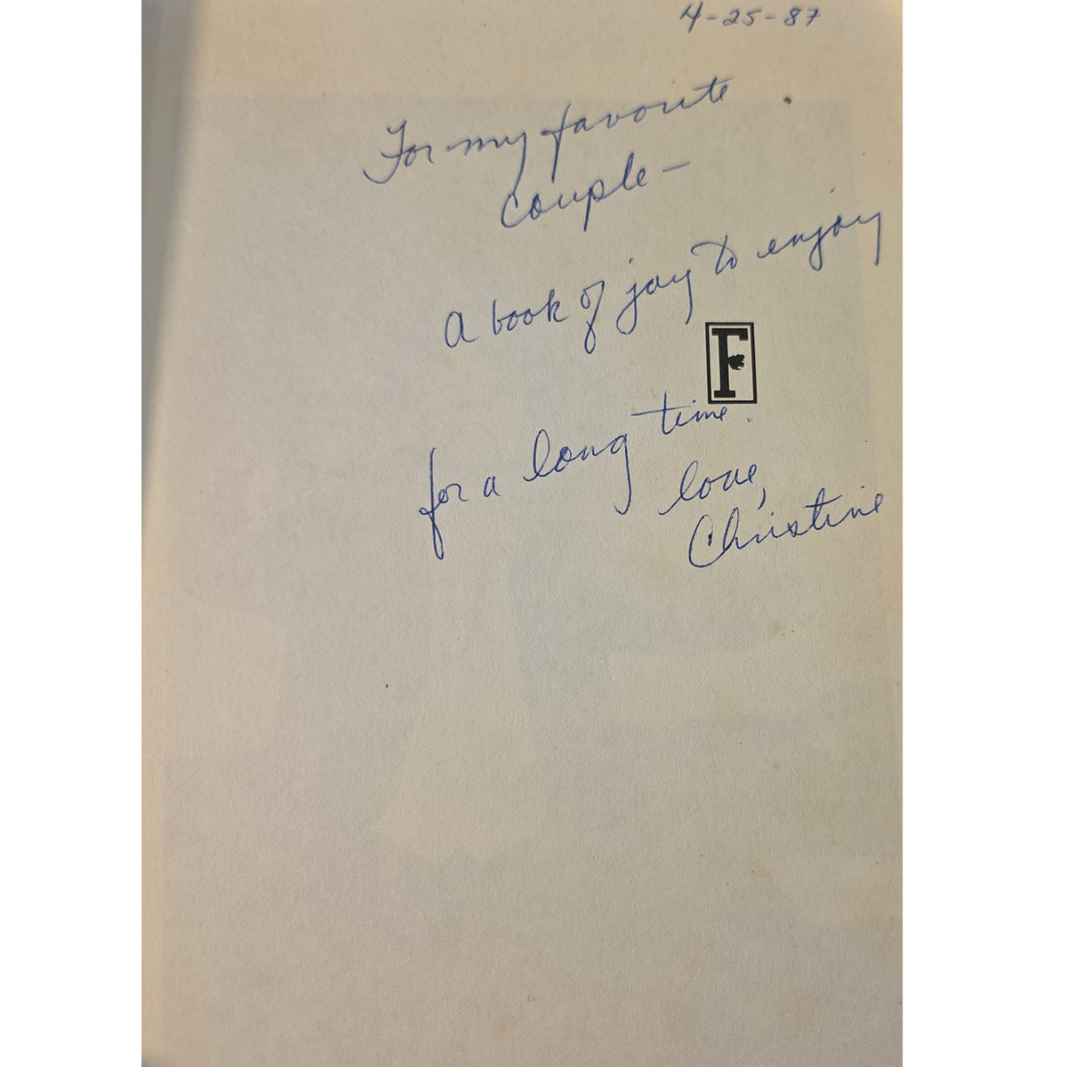 A handwritten letter on cream-colored paper, signed by Louis Christian in blue ink, with a black-and-white letter 'F' emphasized at the top right.