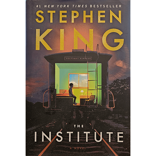 The cover of The Institute by Stephen King features a lone child sitting in a room illuminated by eerie green light, set within an old train car against a dark, ominous sky, symbolizing isolation and mystery.