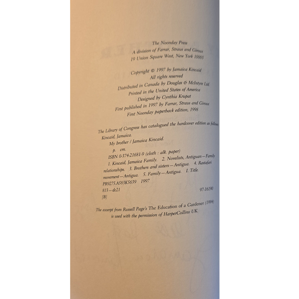 A close-up of a book's printed copyright page, showing text for 'The Tomorrow's War' published by The Tomorrow's Day Press, photographed against a warm beige background.
