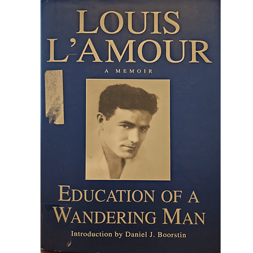 Cover of Louis L'Amour's memoir "Education of a Wandering Man," featuring a vintage photograph of the author and a classic blue background with bold typography, capturing the essence of his adventurous spirit.