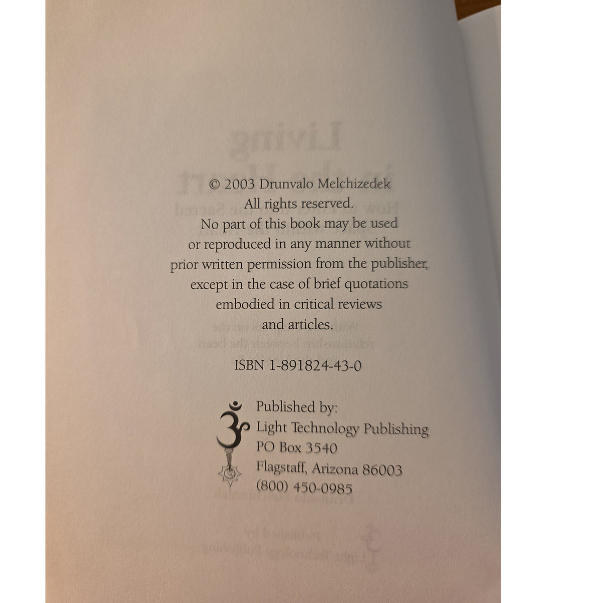 A close-up of a book's copyright page showing printed text and publisher information on an off-white page.