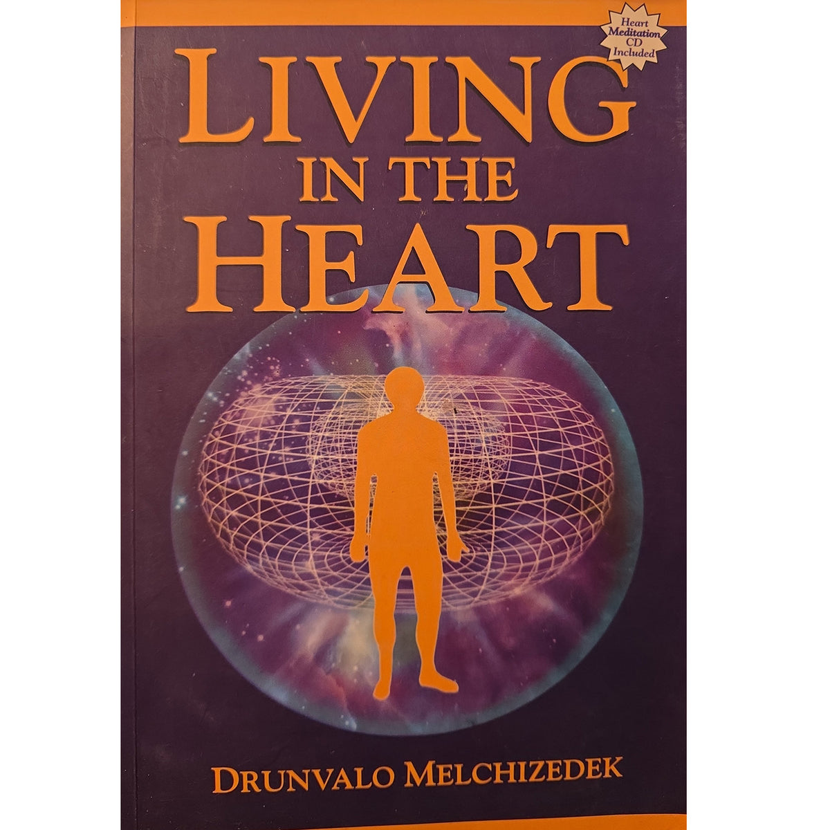 Book cover of 'Living in the Heart' by Drunvalo Melchizedek, featuring a dark purple background with orange title text and an orange human silhouette standing in front of a glowing globe graphic.