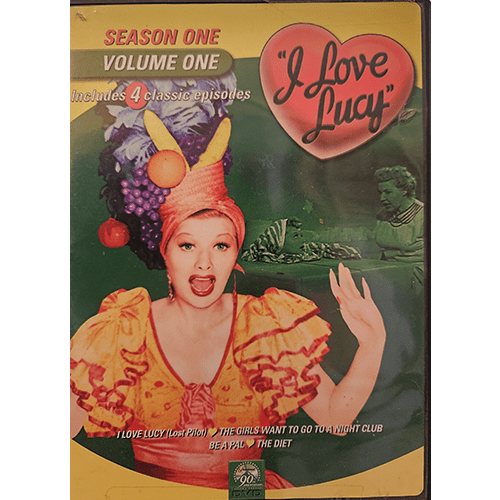 Cover of I Love Lucy Season One, Volume One DVD, featuring Lucille Ball in her iconic fruit hat and colorful outfit from a classic episode. Text highlights four included episodes from the first season.