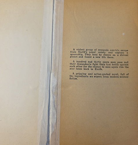 A close-up of a vintage book's interior page with printed text on aged tan paper, showing the page edges and a vertical binding seam.