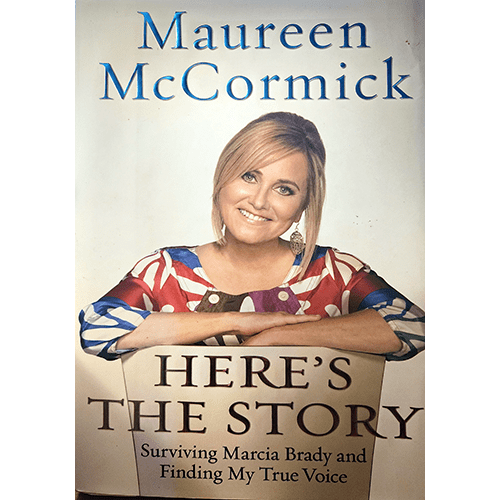 Cover of Here's the Story by Maureen McCormick, showing her smiling in a colorful dress. The subtitle reads, "Surviving Marcia Brady and Finding My True Voice," capturing her journey of self-discovery.