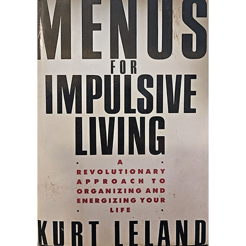 Cover of Menus for Impulsive Living by Kurt Leland, featuring bold black and red typography on a minimalist white background. Subtitled "A Revolutionary Approach to Organizing and Energizing Your Life."