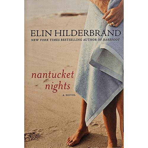 The cover of Nantucket Nights shows a woman standing on a beach holding a towel, capturing the serenity and intrigue of Elin Hilderbrand's tale of friendship, betrayal, and secrets on Nantucket Island.