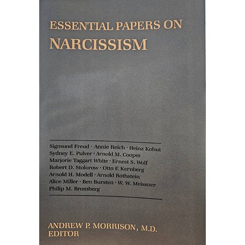 The cover of "Essential Papers on Narcissism" features a minimalist design with a bold, serif title font against a muted background, reflecting the book’s scholarly approach to psychoanalytic theory.