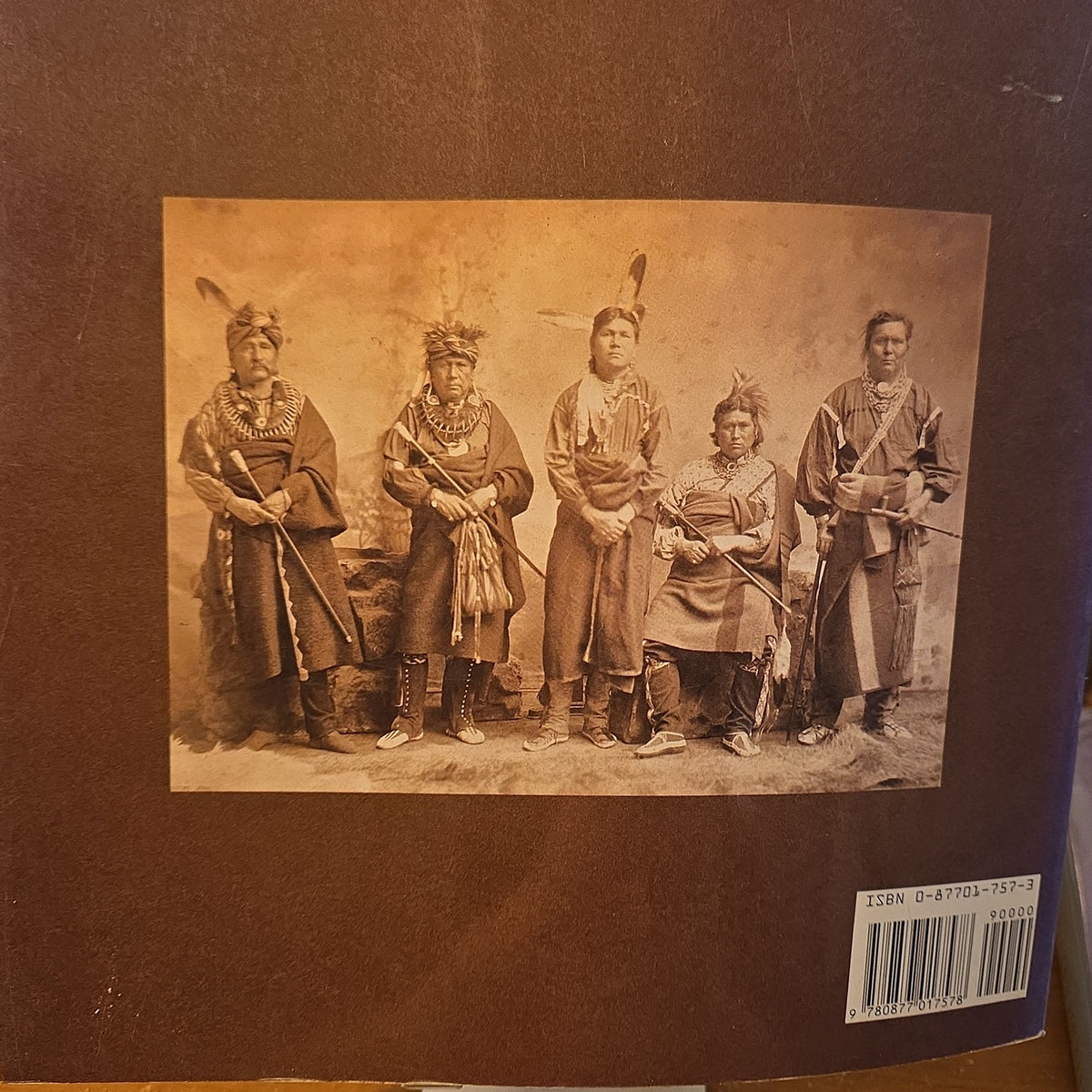 Back cover of Native American Portraits featuring a historical group portrait of five Native American people.
