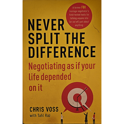 Cover of "Never Split the Difference: Negotiating As If Your Life Depended On It" by Chris Voss. The design features bold text with a striking yellow and black color scheme, representing the intensity of negotiation.