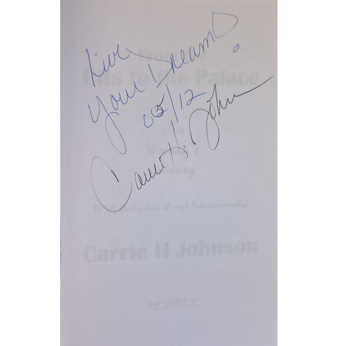 Carrie H. Johnson’s handwritten signature and “Live Your Dreams!” inscription inside From the Pits to the Palace.