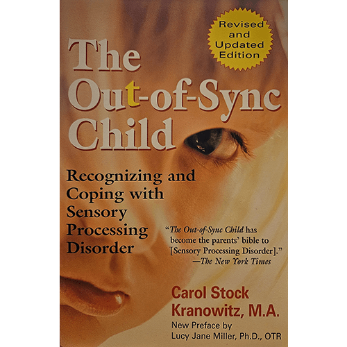 Cover of The Out-of-Sync Child by Carol Kranowitz, featuring a close-up of a child's face with a warm beige and yellow background. The title is in bold white text, with a revised edition label in the top right corner.