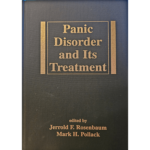 Cover of Panic Disorder and Its Treatment, edited by Jerrold F. Rosenbaum and Mark H. Pollack. The hardcover has a black background with gold embossed text, providing a professional appearance.