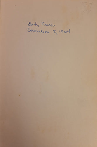 A close-up of a beige paper page with handwritten blue ink text reading 'Betty Frazee December 8, 1964' near the top.