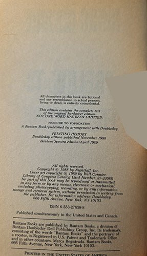 A close-up of a vintage book's printed copyright page showing text on aged, yellowed paper.